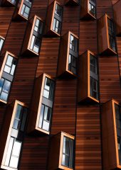 A wall of windows that have been designs to pop out of the wall in a design feature