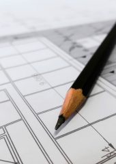 A pencil on top of building plans